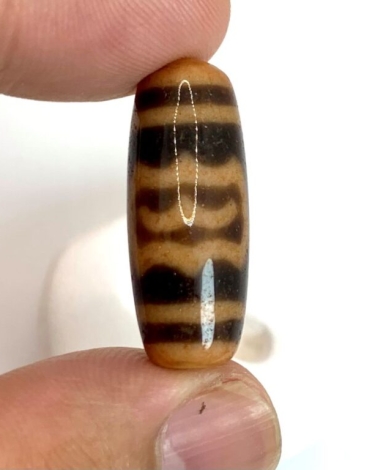 Ý nghĩa và tác dụng phong thủy của Dzi Kim Sí Điểu